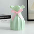 Nordic durable plastic flower vase with pink ribbon, perfect modern home accent for stylish decor.