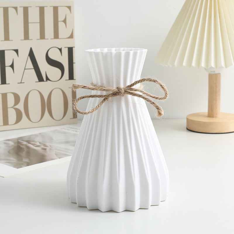 Nordic Durable Plastic Flower Vase – Modern Home Accent | Elden Home on a stylish table with decorative items.