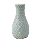 Durable plastic flower vase with a textured diamond pattern, perfect for modern home decor.