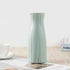 Nordic Durable Plastic Flower Vase – Modern Home Accent | Elden Home displayed on a table, featuring a sleek design.