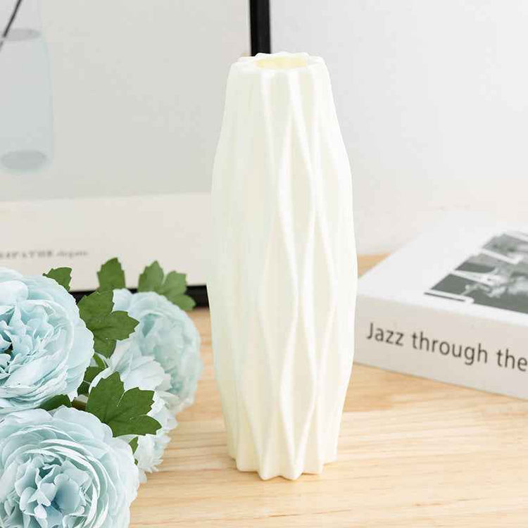 Nordic Durable Plastic Flower Vase – Modern Home Accent | Elden Home on a wooden table with flowers.