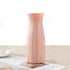 Nordic Durable Plastic Flower Vase – Modern Home Accent | Elden Home in pink color on a table.