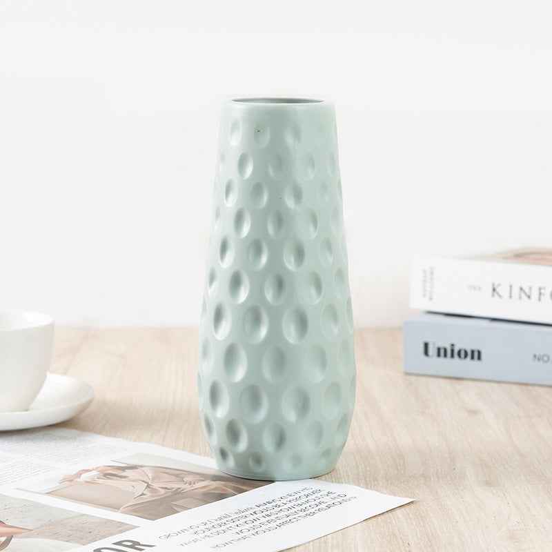 Nordic durable plastic flower vase in light blue with modern design and textured surface.