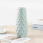 Nordic durable plastic flower vase in light blue with modern design and textured surface.