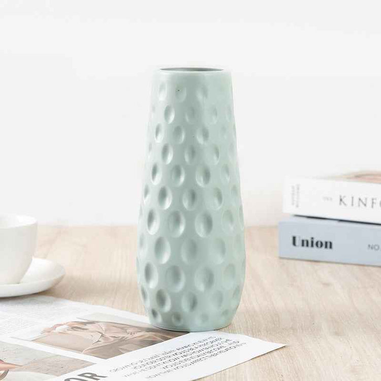Nordic durable plastic flower vase in light blue with modern design and textured surface.