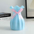 Nordic Durable Plastic Flower Vase – Modern Home Accent | Elden Home in light blue with a ribbon.