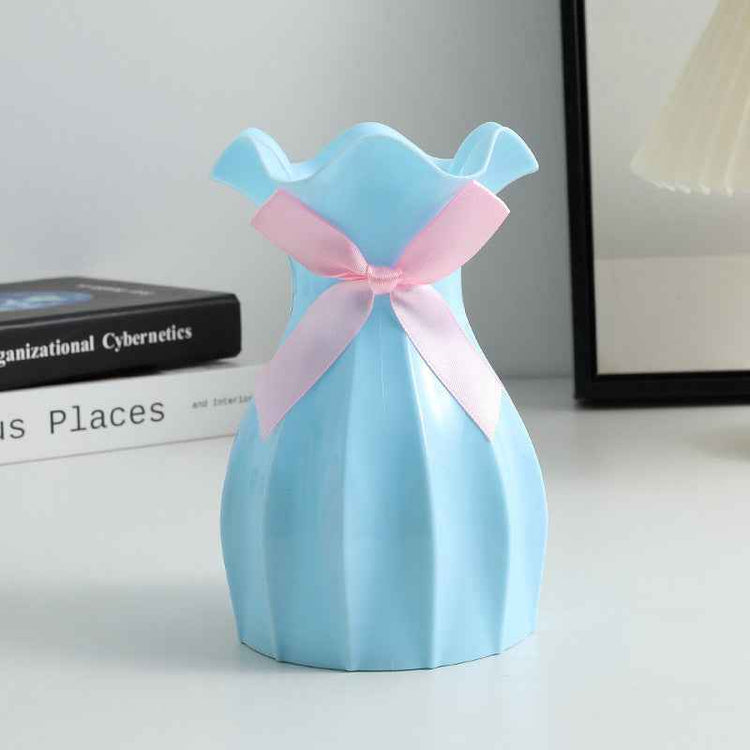 Nordic Durable Plastic Flower Vase – Modern Home Accent | Elden Home in light blue with a ribbon.