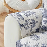 Stretch fabric sofa cover featuring a beautiful floral design, perfect for protecting your furniture from spills and stains.