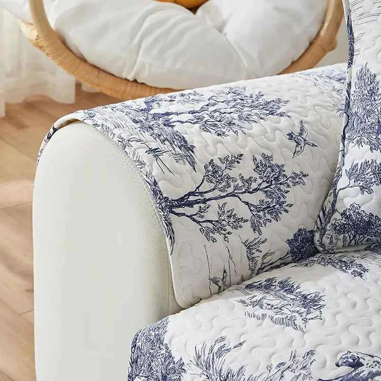 Stretch fabric sofa cover featuring a beautiful floral design, perfect for protecting your furniture from spills and stains.